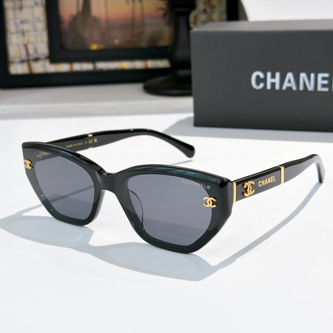 Chanel cat-eye sunglasses, black frame, dark tinted lenses