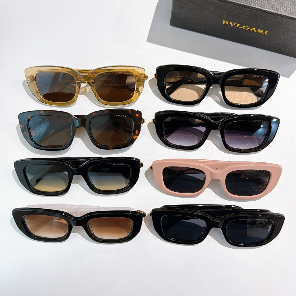 Assorted sunglasses set with black, tan, pink, tortoise, and gold frames and logo accents.