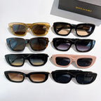 Assorted sunglasses set with black, tan, pink, tortoise, and gold frames and logo accents.