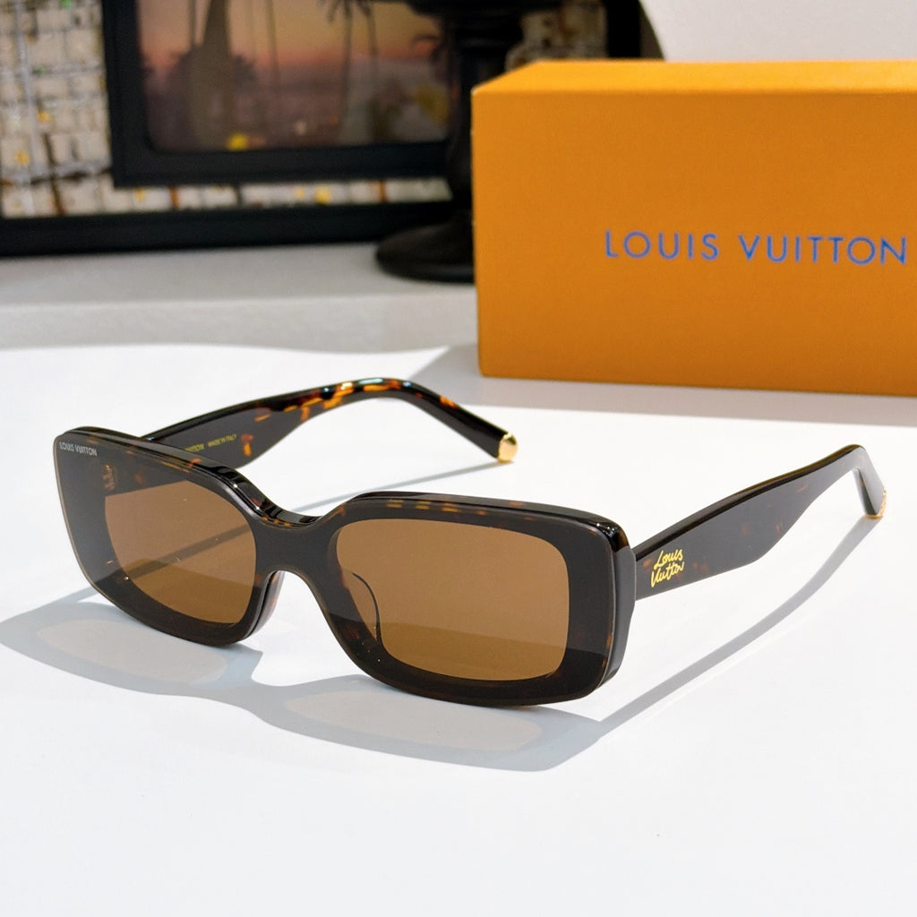 Louis Vuitton sunglasses with tortoiseshell-style frames, brown lenses, gold-tone tips.
