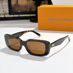Louis Vuitton sunglasses with tortoiseshell-style frames, brown lenses, gold-tone tips.