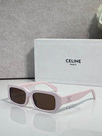 Celine sunglasses with white frame, pale pink temples, and dark lenses