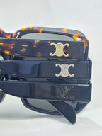 Celine sunglasses temple close-up with Celine emblem on tortoise and dark bands