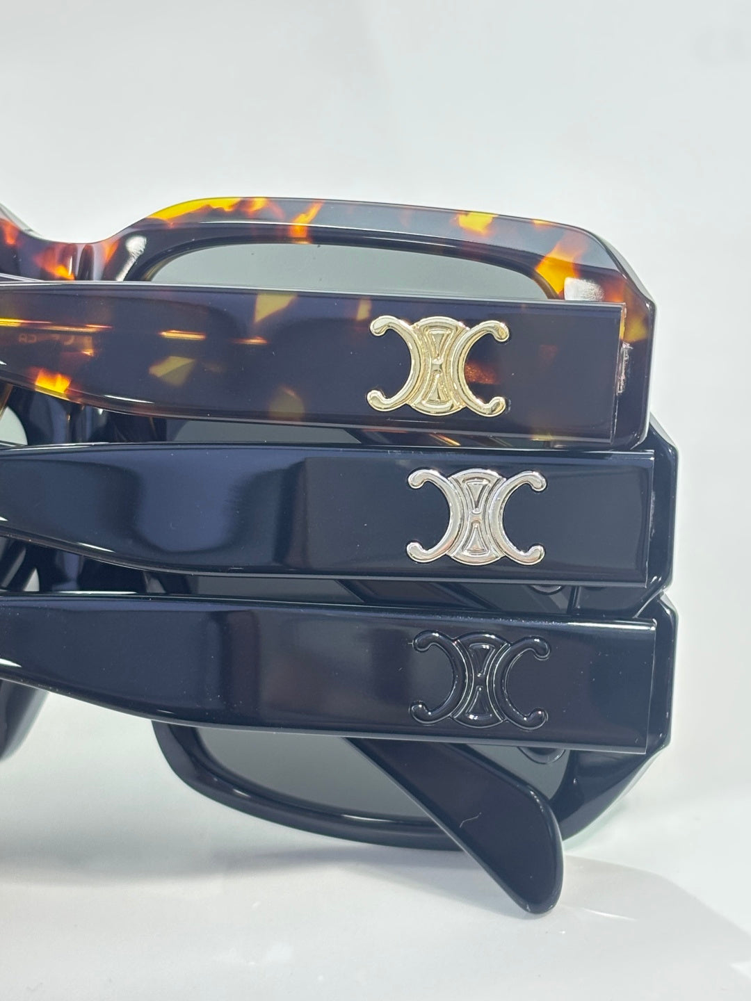 Celine sunglasses temple close-up with Celine emblem on tortoise and dark bands