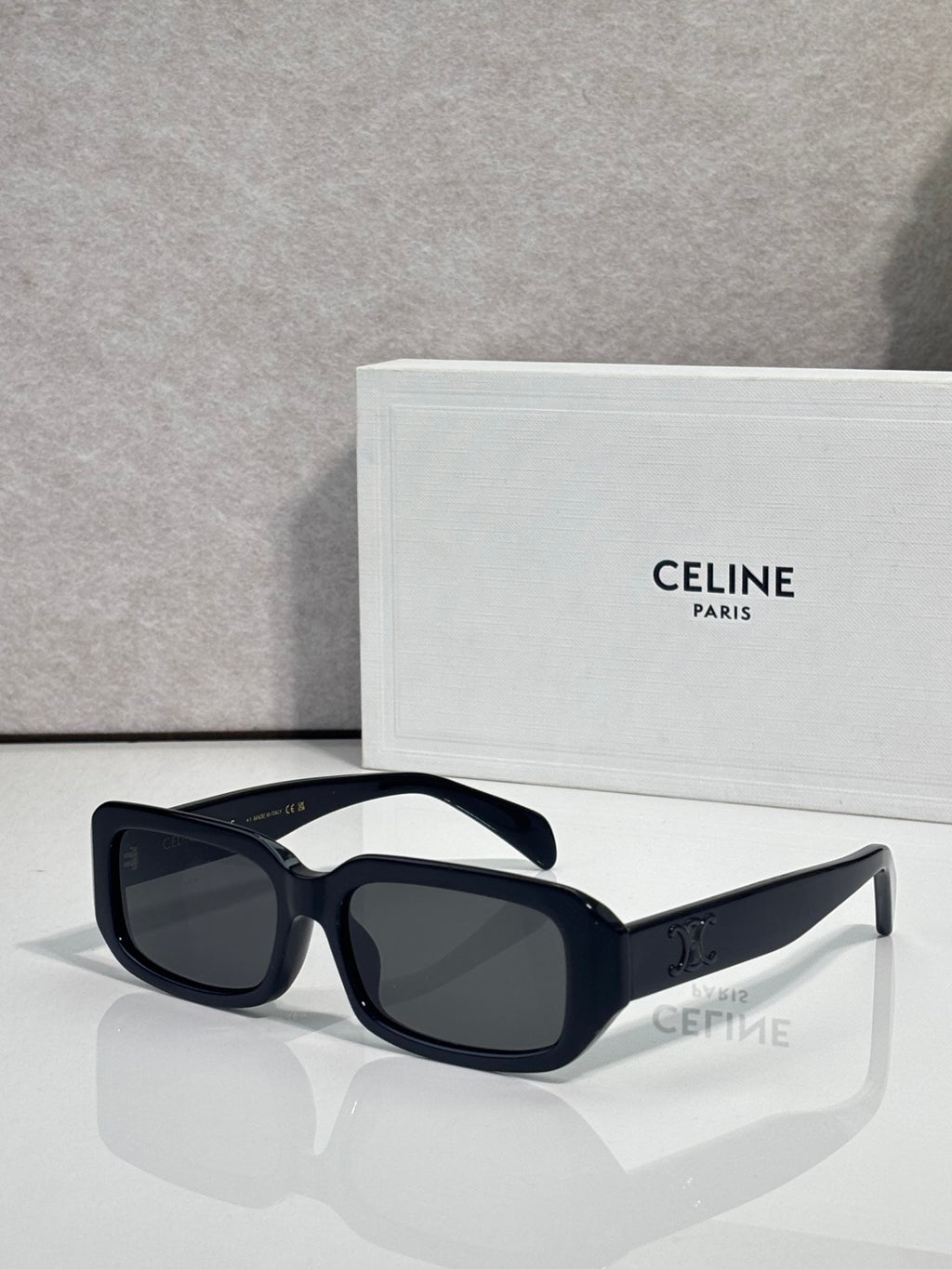 Celine sunglasses hinge close-up on glossy dark frame temples