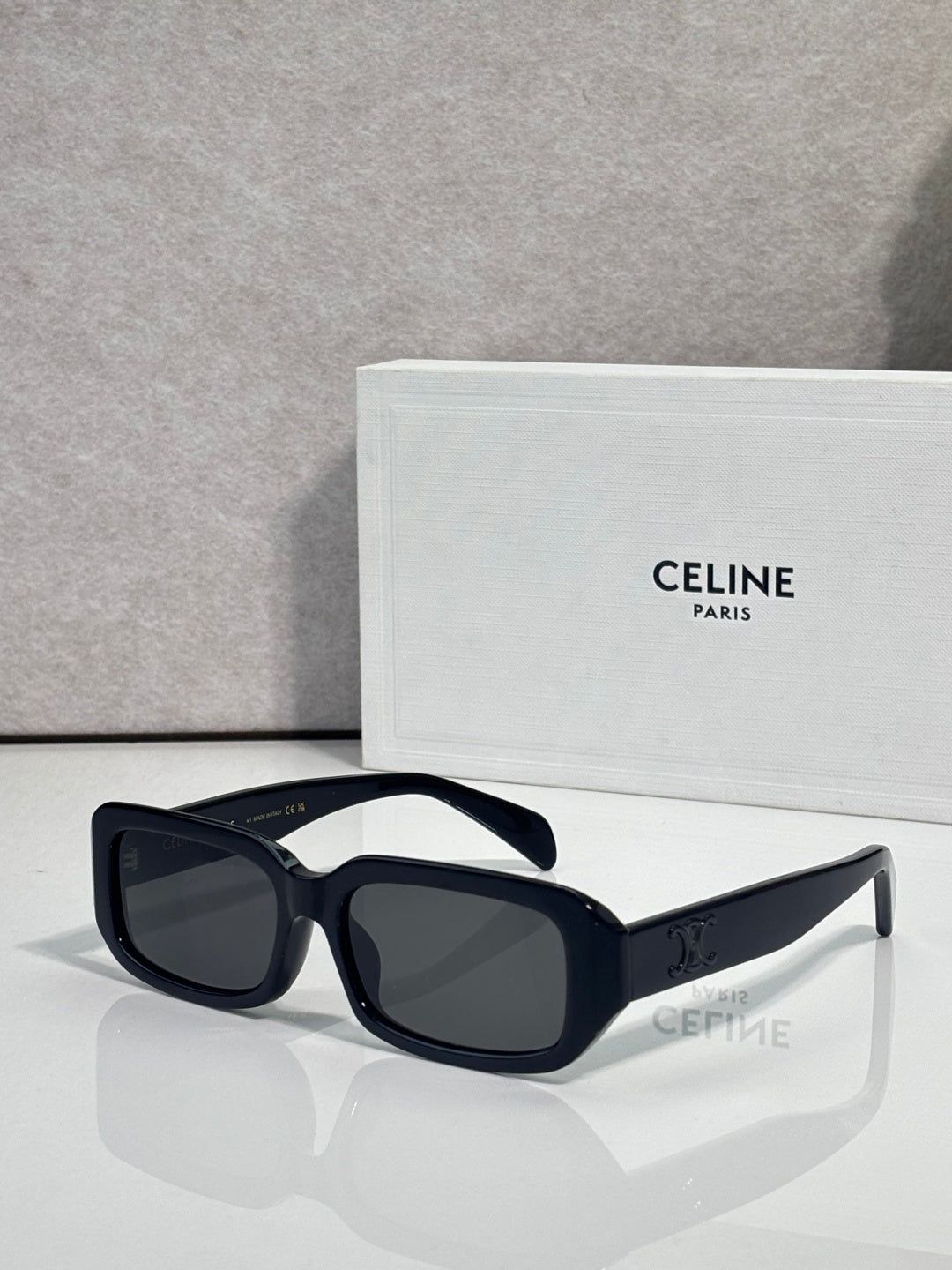 Celine sunglasses hinge close-up on glossy dark frame temples