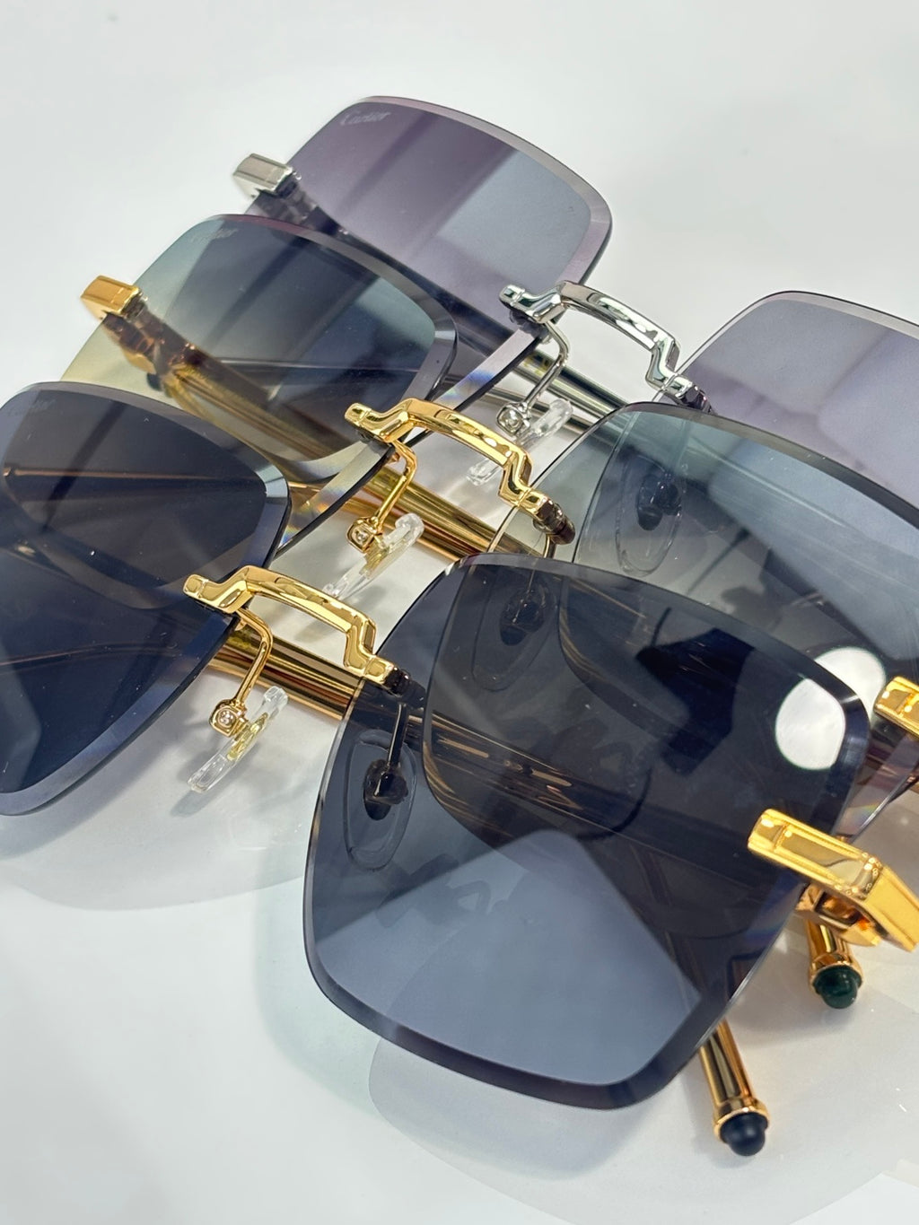 Cartier optical glasses close-up with blue-tinted lenses and gold frame hardware