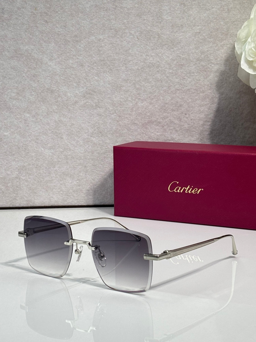 Cartier optical glasses with dark metal frame and dark gray-tinted lenses