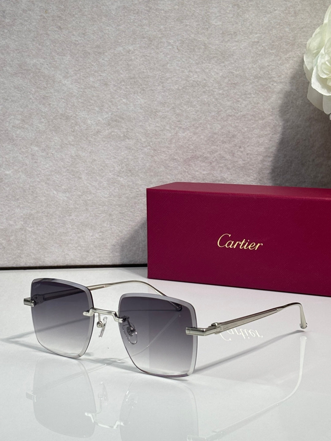 Cartier optical glasses with dark metal frame and dark gray-tinted lenses