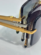 Cartier optical glasses close-up: gold hinges and temples with Cartier engraving