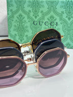 Gucci sunglasses set, round frames with purple and brown lenses in gold-tone.