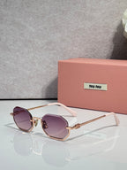 MiuMiu sunglasses with gold frame, purple tinted lenses, rounded butterfly shape