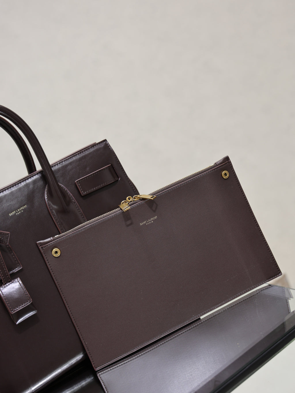 YSL tote bag with front flap and gold-tone button details