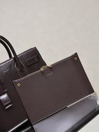YSL tote bag with front flap and gold-tone button details