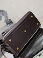 YSL dark brown leather bag with gold-tone stud buttons and side panel detail