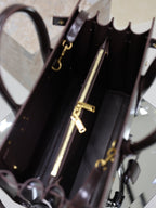 YSL tote bag interior with gold-tone zipper and hanging hardware