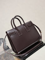 YSL dark brown leather tote bag with shoulder strap, top handles, and front pocket