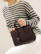 YSL leather tote bag with front flap and dangling strap charm, dark brown.