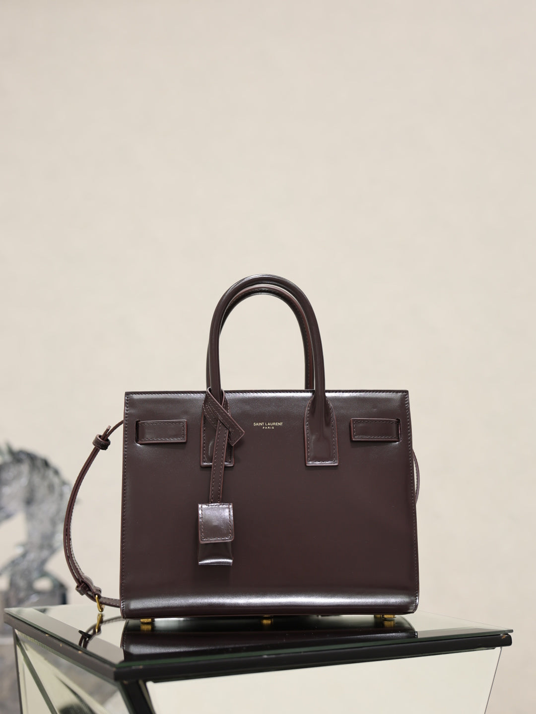 Dark brown YSL tote bag with top handles and front patch pockets