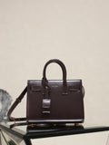 Structured dark brown leather handbag with double top handles and front strap details