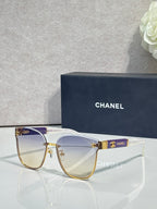 Gold-tone eyeglasses with clear lenses and light purple top bar accents