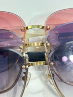 Pink and lavender gradient eyeglasses with gold bridge and front rivets