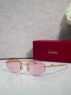 Aviator sunglasses with gold-tone metal frame and pink tinted lenses