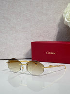 Aviator sunglasses with gold-tone metal frame and pale amber tinted lenses