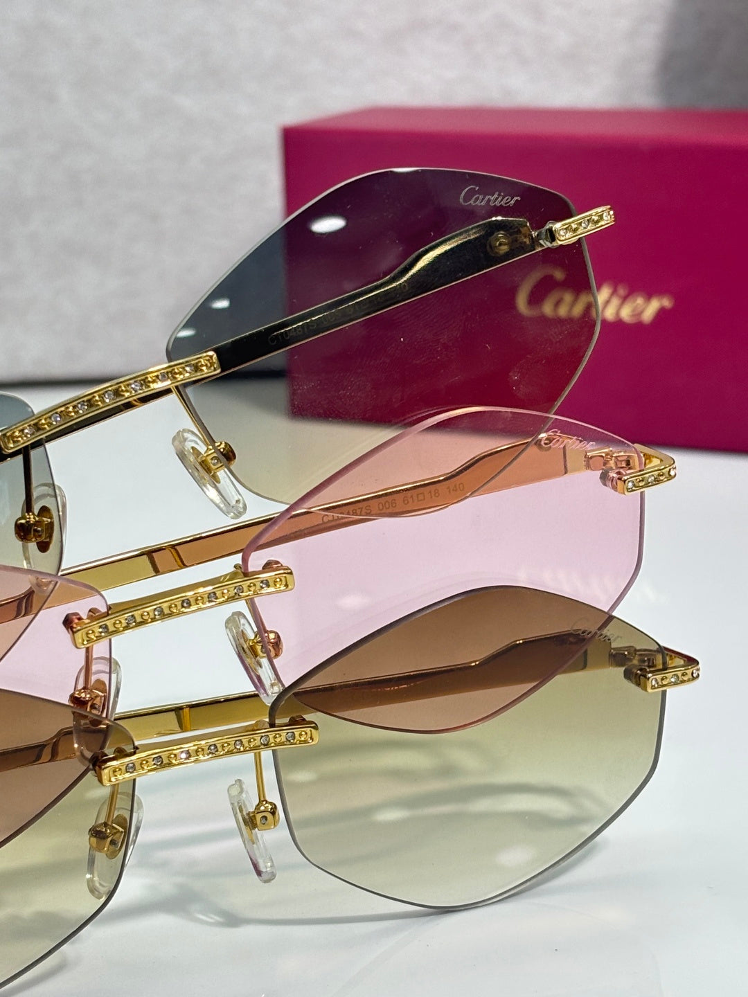 Aviator glasses with gold-tone rhinestone detailing and tinted lenses