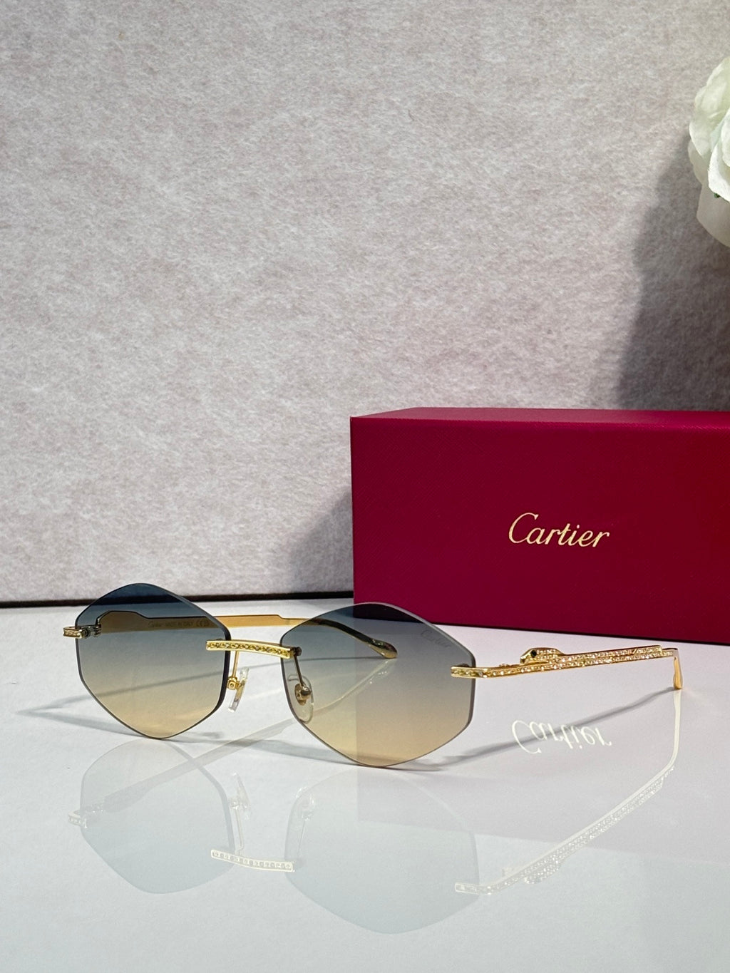 Aviator sunglasses with gold-tone metal frame and amber tinted lenses