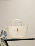 YSL bag in cream leather with gold clasp and top handles, structured mini silhouette.