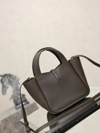 YSL dark leather top-handle mini bag with gold-tone YSL lock and crossbody strap