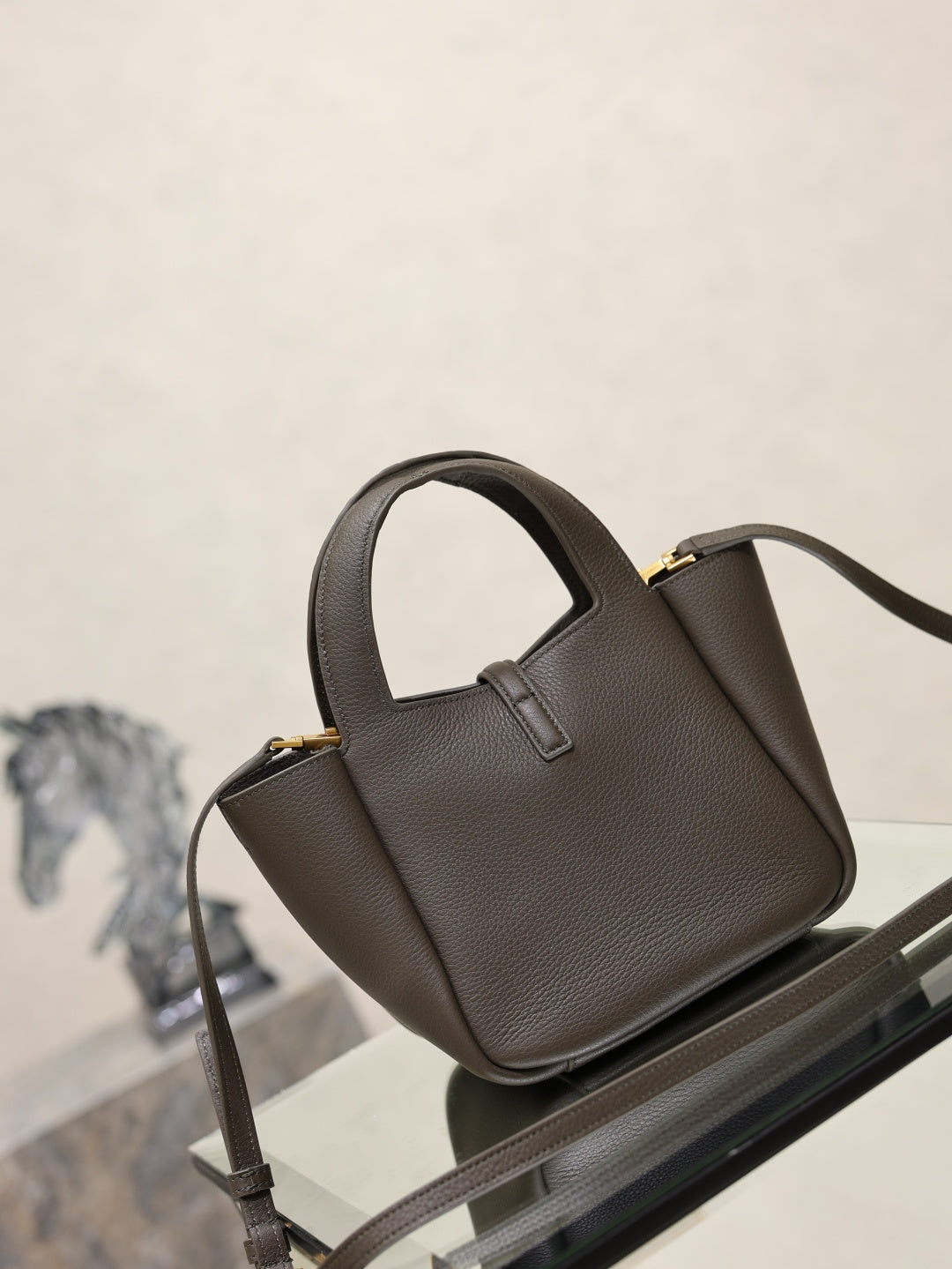 YSL dark leather top-handle mini bag with gold-tone YSL lock and crossbody strap