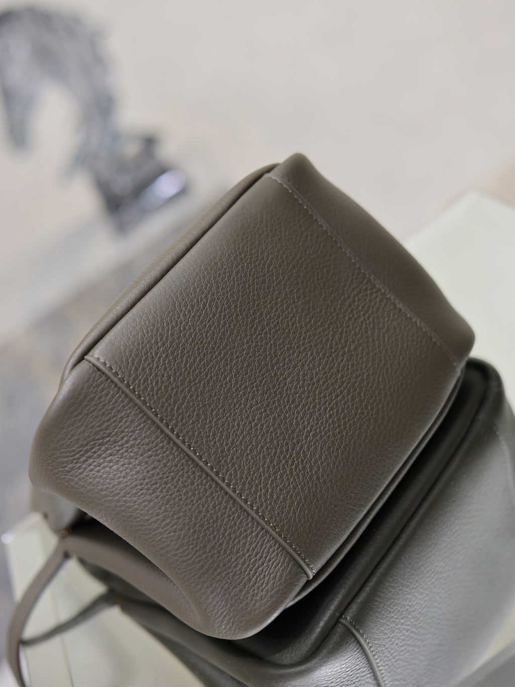 YSL dark leather side view mini bag with stitched panel and top-handle