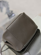YSL dark leather side view mini bag with stitched panel and top-handle