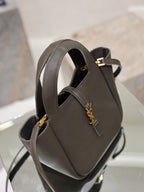 YSL dark leather mini bag, front clasp with gold-tone YSL emblem, top handle