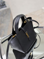 YSL black leather mini tote bag side view with gold logo accent and strap