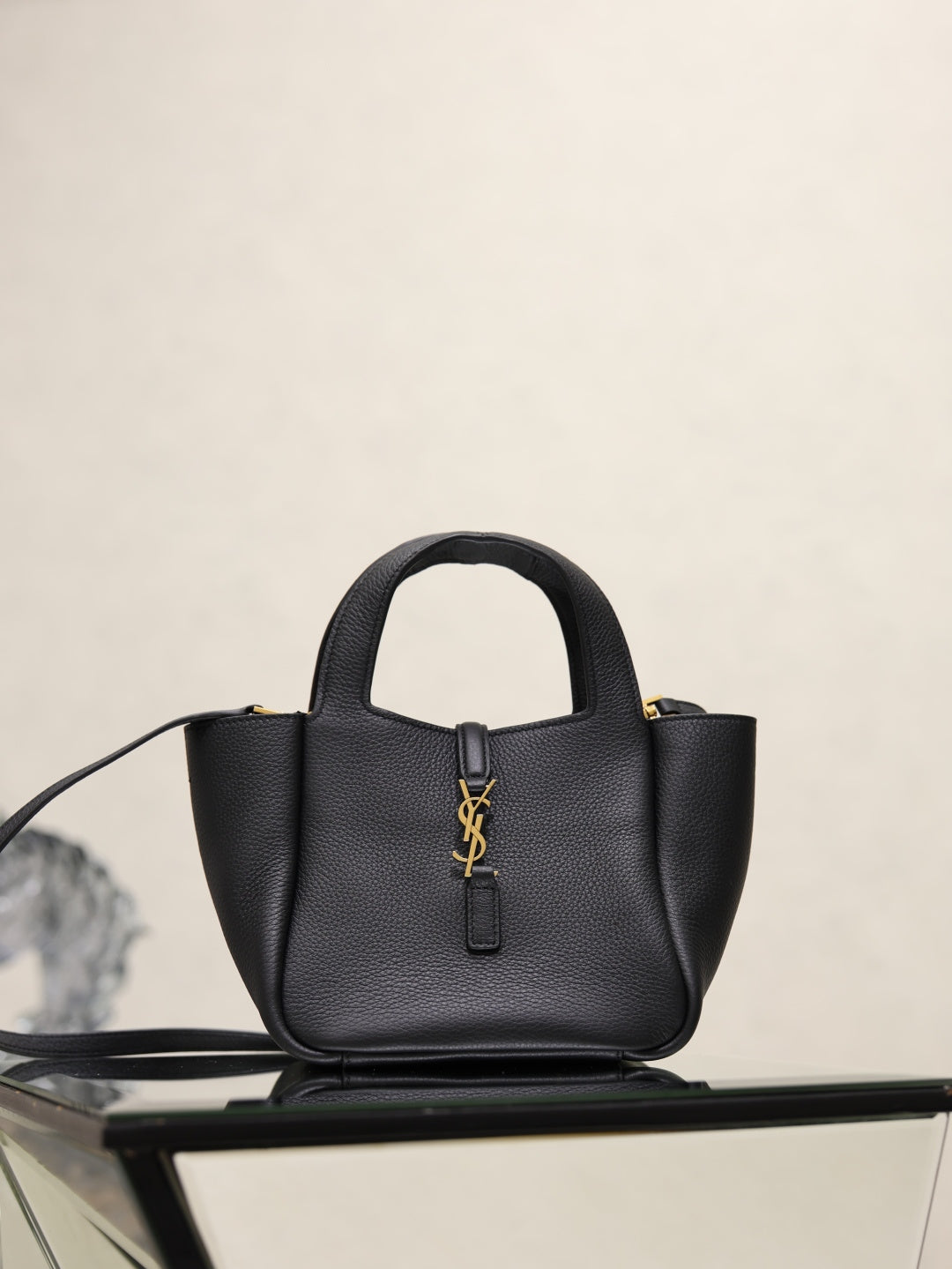 YSL black leather mini tote bag with top handles and gold logo plaque