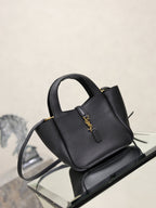 YSL black leather mini tote bag with top handle, shoulder strap, and gold logo