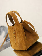 Tan suede mini tote bag front view with double handles and shoulder strap.