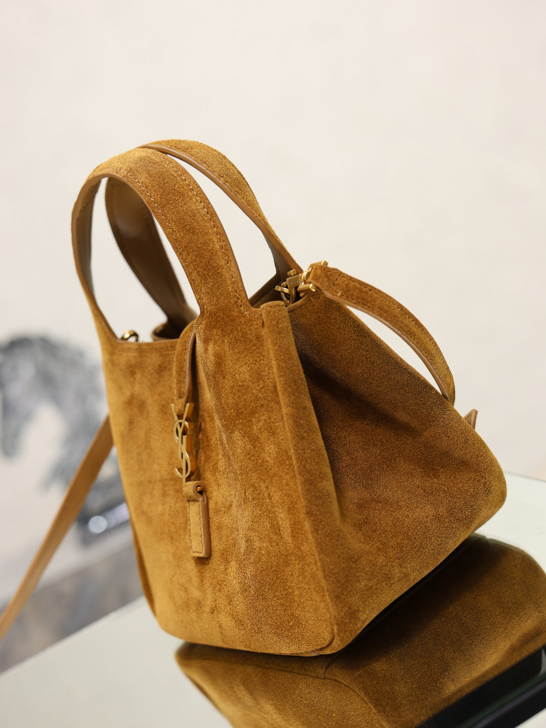 Tan suede mini tote bag front view with double handles and shoulder strap.