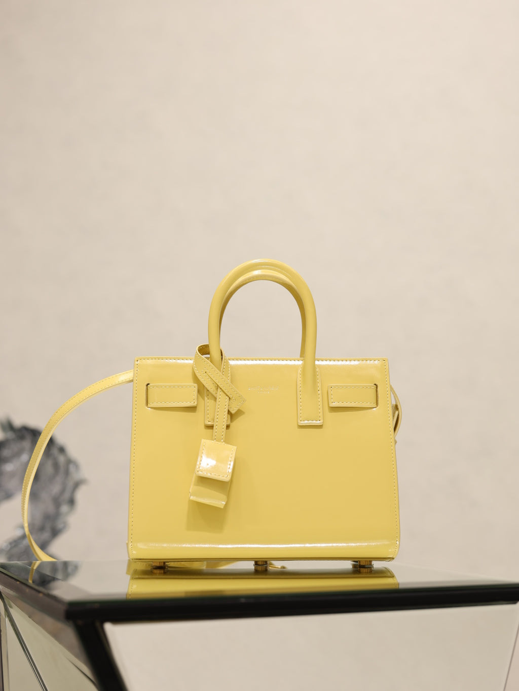 YSL mini handbag with top handles, glossy yellow, front flap and buckle straps