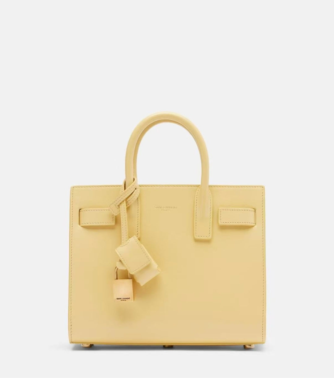 Light yellow structured leather tote bag with top handles and front flap pockets