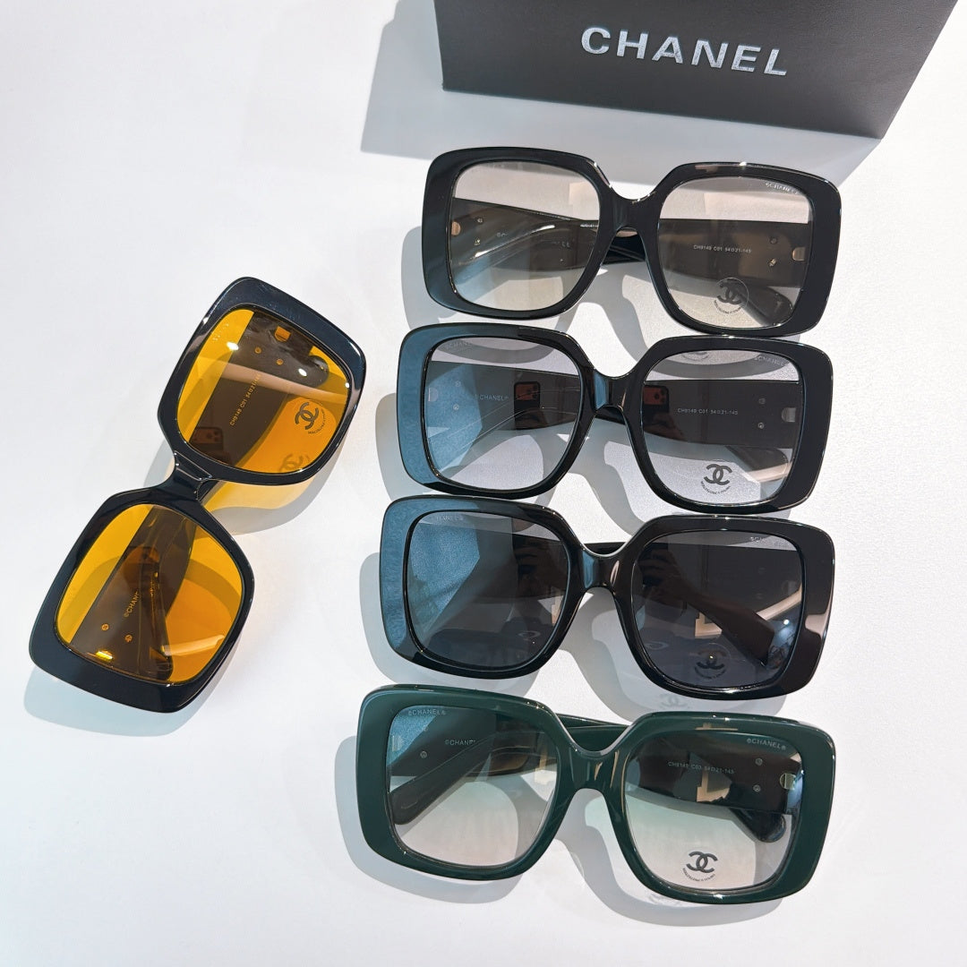 Assorted square sunglasses in black, blue, green, and amber tones with gold CC logos.