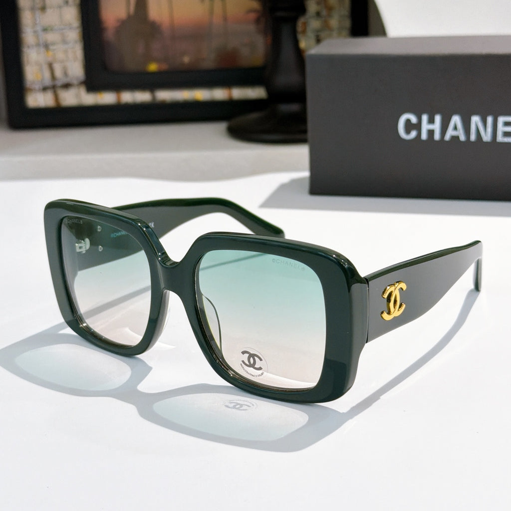 Dark green square sunglasses with tinted lenses and gold CC logo on temple.