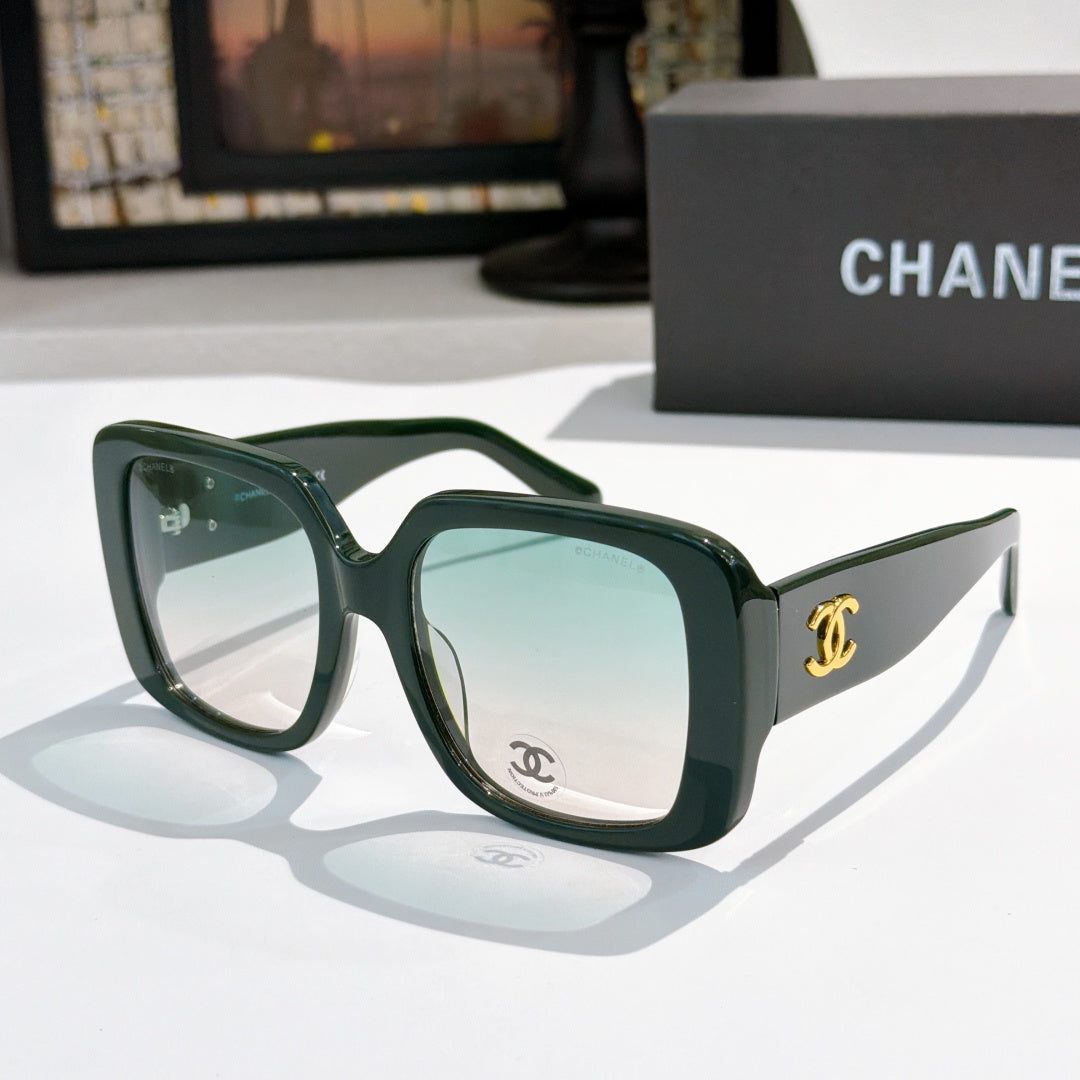 Dark green square sunglasses with tinted lenses and gold CC logo on temple.