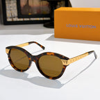 Round tortoiseshell sunglasses with amber-tinted lenses and gold logo temples