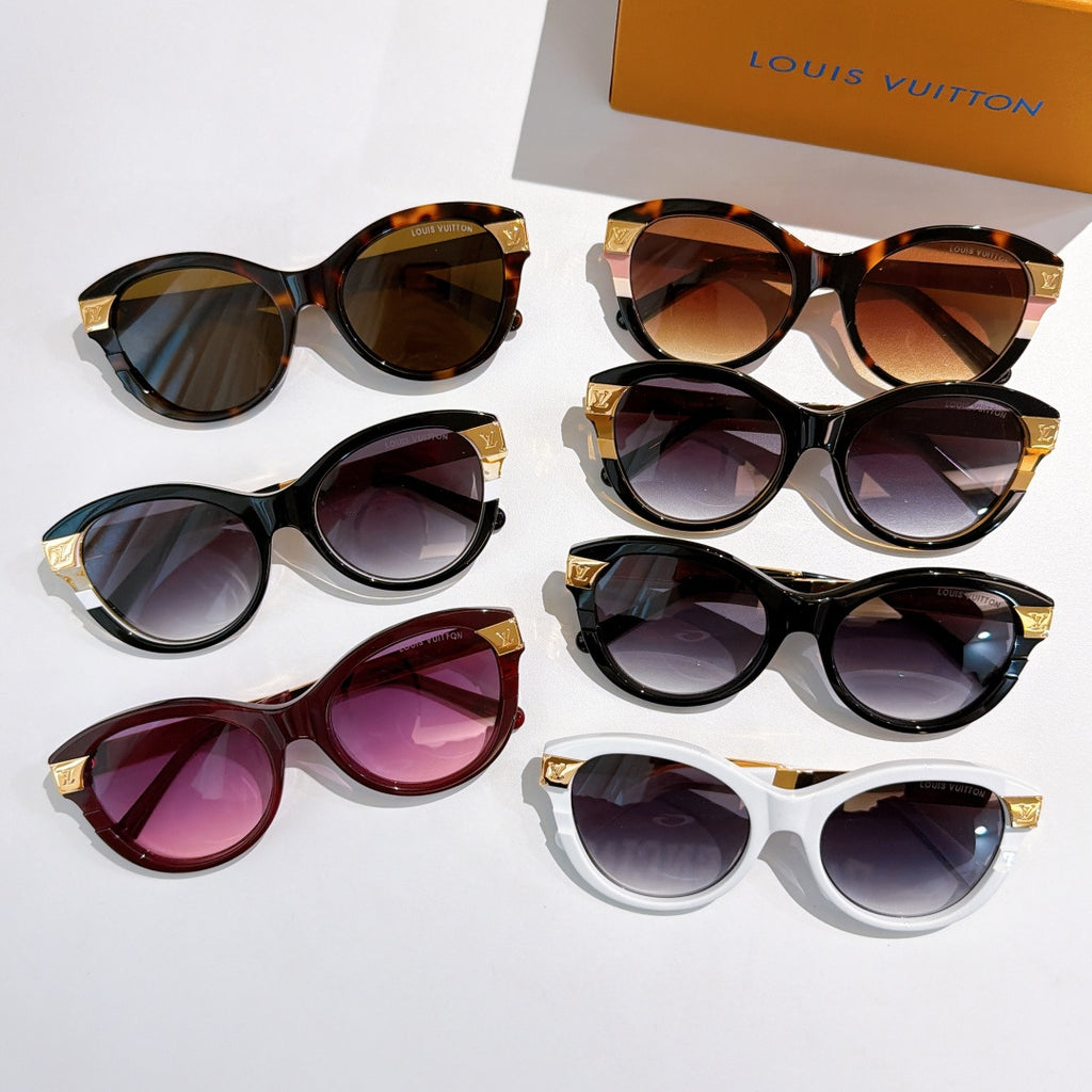 Assorted round sunglasses with gold logo temple arms and tinted lenses in dark, white, and tortoiseshell