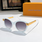 Round white sunglasses with purple-tinted lenses and gold logo temple arms