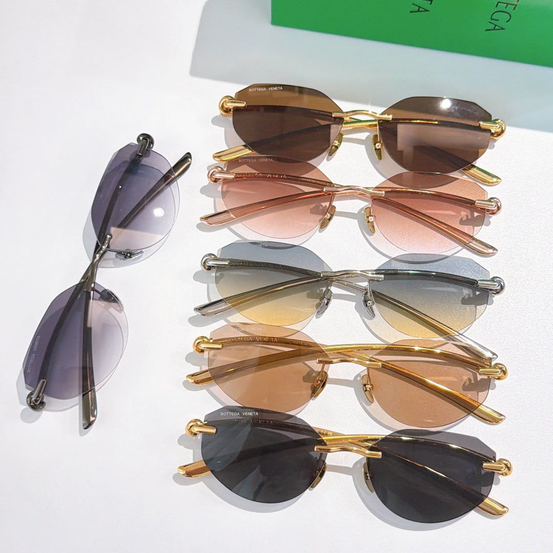 Stacked sunglasses with tinted lenses and mixed gold and dark frames.